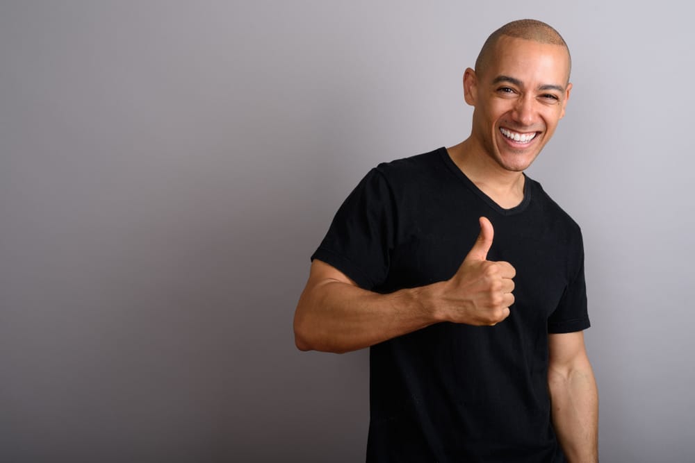 man giving thumbs up about scalp micropigmentation